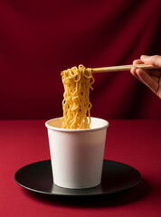 Red chilies and sambal highlight the spiciness of noodles in the mockup noodle cup.