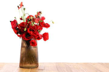 Beautiful red poppy flowers in vase on wooden table against white background