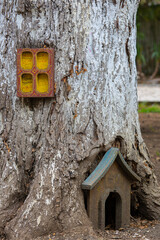 Thick tree trunk with ornaments