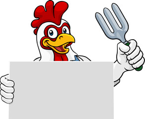 A gardener, farmer or handyman chicken rooster cartoon mascot man holding a gardening tool