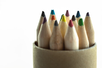 Set of brown crayons or color pencils with its sharpened tip facing upward. An artistic display of...