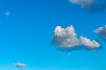 Lonely clouds against clear sky