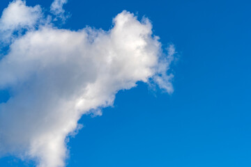 Lonely clouds against clear sky