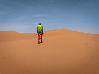 Backpacking woman hiking  in the desert