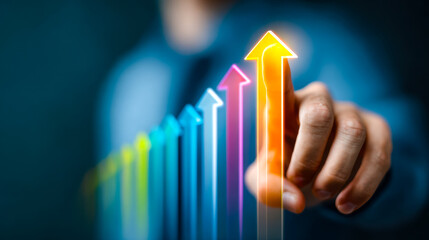 Business professional pointing at colorful upward trend arrows symbolizing growth and success