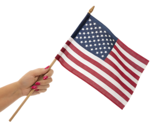 A hand holding a miniature american flag with red nail polish against a black background studio shot