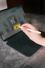 Woman ordering in online store using digital tablet. Shopping on internet.