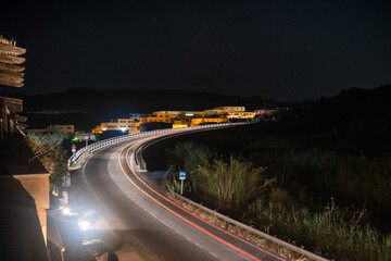Light trails leading up a road