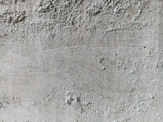 Textured White Wall with Peeling Paint. Close-up of a weathered white wall showing rough textures, chipped paint, and signs of decay, perfect for abstract backgrounds