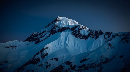 Majestic Snow-Capped Mountain Peak at Dusk