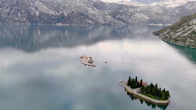 Aerial view of islands and boat on kotor bay in Montenegro during daytime