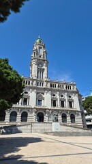 Front view of Porto City Hall (Câmara Municipal do Porto), located in Avenida dos Aliados, Portugal, under clear summer skies. A landmark of civic pride and neoclassical architecture.