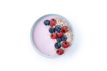 Healthy smoothie bowl with berries isolated on white background. Top view