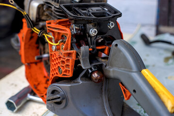 Photo of partially disassembled chainsaw