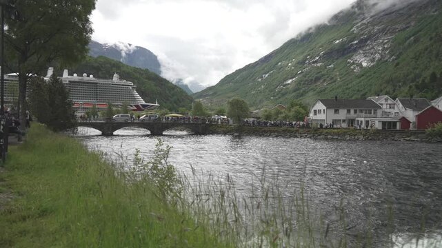 View of cruise ship, waterfall and church in Hellesylt, Sunnylvsfjorden, Stranda Municipality, Norway, Scandinavia, Europe