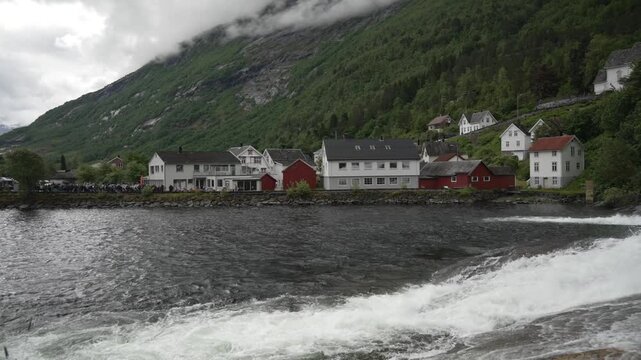 View of cruise ship and waterfall in Hellesylt, Sunnylvsfjorden, Stranda Municipality, Norway, Scandinavia, Europe