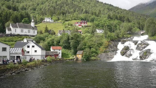 View of waterfall and church on sunny day in Hellesylt, Sunnylvsfjorden, Stranda Municipality, Norway, Scandinavia, Europe