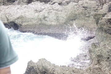 Ocean Waves Crashing Against Rugged Coastal Rocks: A Dramatic Seascape