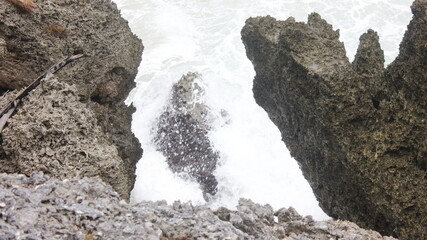 Oceanic Fury: Whitewater Crashing Between Rugged Coastal Rocks