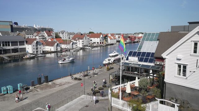 View of waterside cafe and architecture in Haugesund from Risoy Bridge on a sunny day, Haugesund, Rogaland County, Norway, Scandinavia, Europe