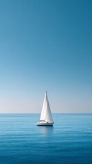Obraz premium White sailboat gliding across calm, blue waters, sails billowing under a clear sky, creating a sense of tranquility, freedom, and the spirit of adventure on a perfect day