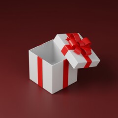 Obraz premium Open white gift box with red ribbon bow viewed from above on a dark red background. 