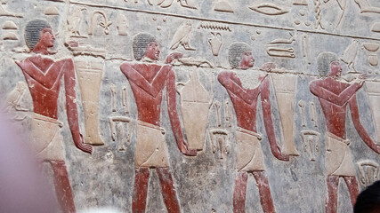 Wall fresco of men carrying jars of provisions for afterlife in tomb of Kagemni, vizier of Pharaoh Teti, Saqqara, Egypt, Old Kingdom.