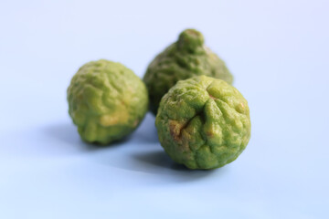 Kafir lime is unique citrus fruit known for its bumpy texture and vibrant green color, often used culinary dishes and traditional remedies. Its aromatic leaves and zest add distinct flavor to