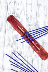 incense sticks for fresh air on white wooden background top view