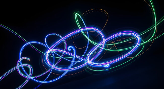 An abstract light painting photograph with swirling trails of blue green and purple neon light.