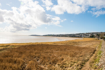 A beautiful seascape of the Grange-Over-Sands and saltmarsh beach on Morecambe Bay in Cumbria, UK.