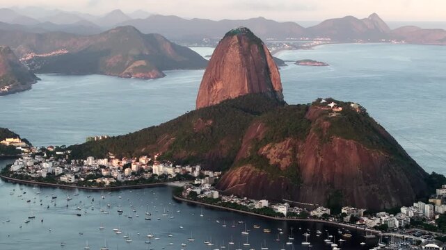 Aerial view of the iconic Sugarloaf Mountain at sunset in Rio de Janeiro, Brazil.	
