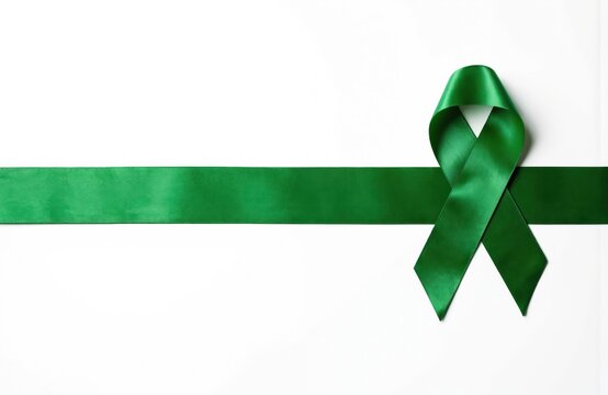 Green ribbon on white background highlights awareness of cancer, mental health, organ donation. Suggested keywords awareness organ donation health transplant brain hope injury international month