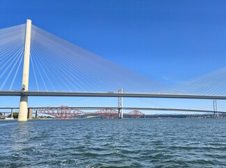 Obraz premium Scenic Alignment of Three Distinct Bridges Over Water – Modern and Classic Architectural Forms in Unified Transport Composition