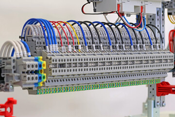 Electrical terminals with connected insulated copper wires with metal lugs. Marking with a thermal printer. 