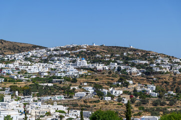 View of Apollonia village with blue domed church and mills, Sifnos, Cyclades, Greece
