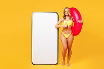 Full body young fun woman wear bikini swimsuit rest near hotel pool big huge blank screen area...