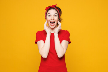 Young surprised woman she wearing red t-shirt casual clothes scream sharing hot news about sales...