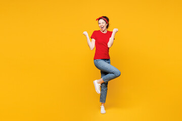 Full body young surprised shocked fun woman she wear red t-shirt casual clothes doing winner...