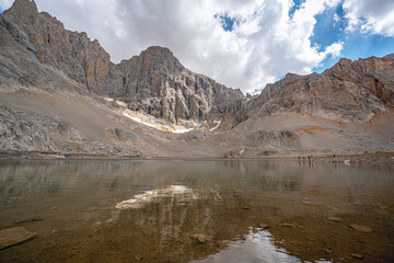 The scenic views of Demirkazık summit, Davlumbaz summit and dipsiz göl at the Aladağlar National park in Niğde, Turkey