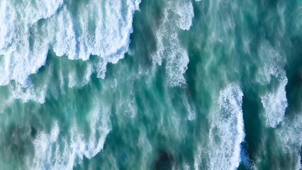 Icy winter ocean waves splashing on a blue shore with icicles on the roof