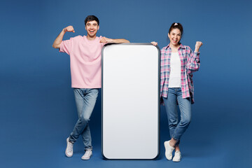 Full body young couple two friends family man woman wear pink casual clothes together big huge...