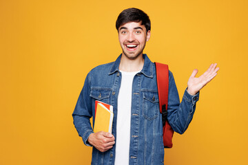 Young shocked surprised impressed boy student he wear jeans casual clothes backpack bag hold books...