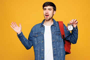 Young shocked surprised sad astonished boy student he wearing denim casual clothes backpack bag...