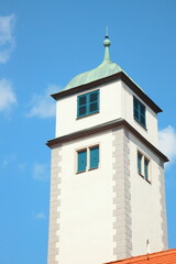 tower, church tower, steeple, historical building, architecture, European style, rooftop, blue sky, vertical composition, city landmark, traditional design, old town, Germany, spire
