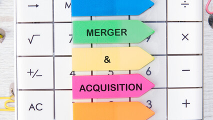 Merger and Acquisition Icon and Global Network with Analyzing Technological Data. MERGER and ACQUISITION written on a sticker on the background of the calculator