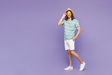 Side profile view young man wear blue beach t-shirt yellow hat sunglasses rest near hotel pool walk...