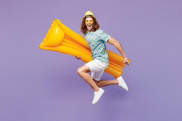 Full body young fun man wear blue beach t-shirt hat sunglasses rest near hotel pool jump high hold...