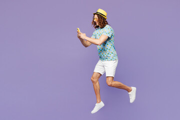 Full body young man wears blue beach t-shirt yellow hat sunglasses rest near hotel pool jump high...
