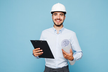 Young architect engineer designer employee man wear white clothes shirt hardhat hold blueprints...